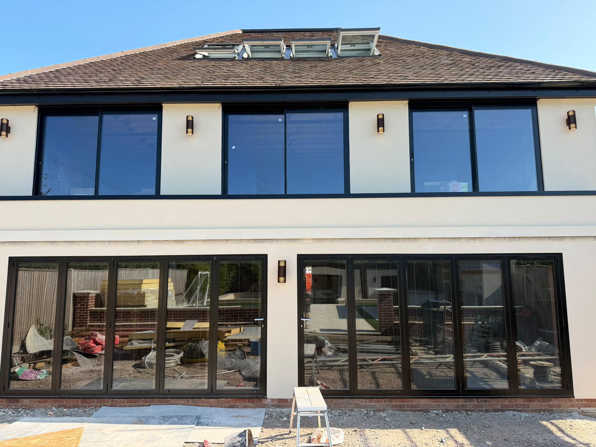 Rear elevation of the property with matching exterior lights